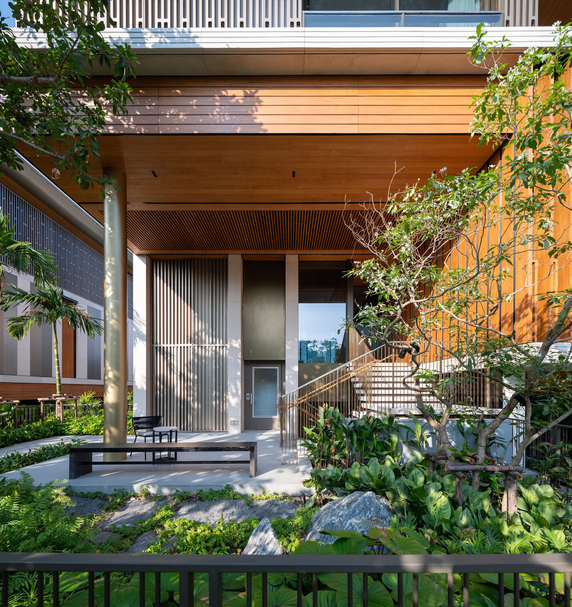 Biophilic community space at Six Senses Residences with native vegetation and natural light